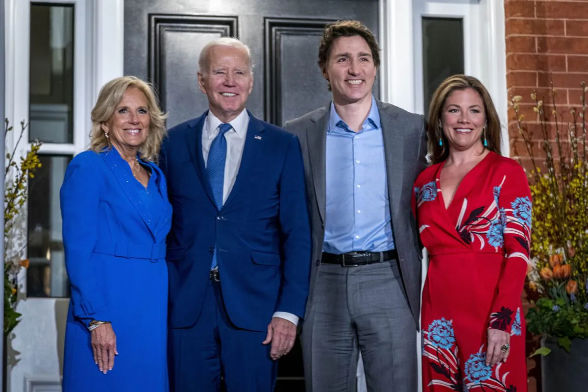 U.S. President Joe Biden and first lady Jill Biden pose for members of the media as they arrive to visit with Prime Minister Justin Trudeau and his wife Sophie Gregoire Trudeau at Rideau Cottage in Ottawa on March 23, 2023. (AP Photo/Andrew Harnik)
