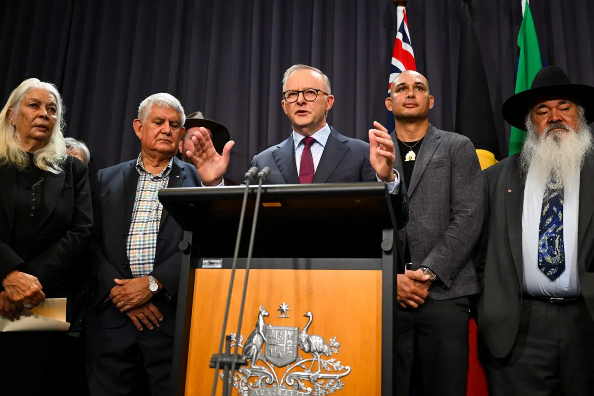 Australian Prime Minister Anthony Albanese surrounded by members of the First Nations Referendum Working Group speaks to the media during a press conference at Parliament House in Canberra, Australia, on March 23, 2023. (AAP Image/Lukas Coch) 