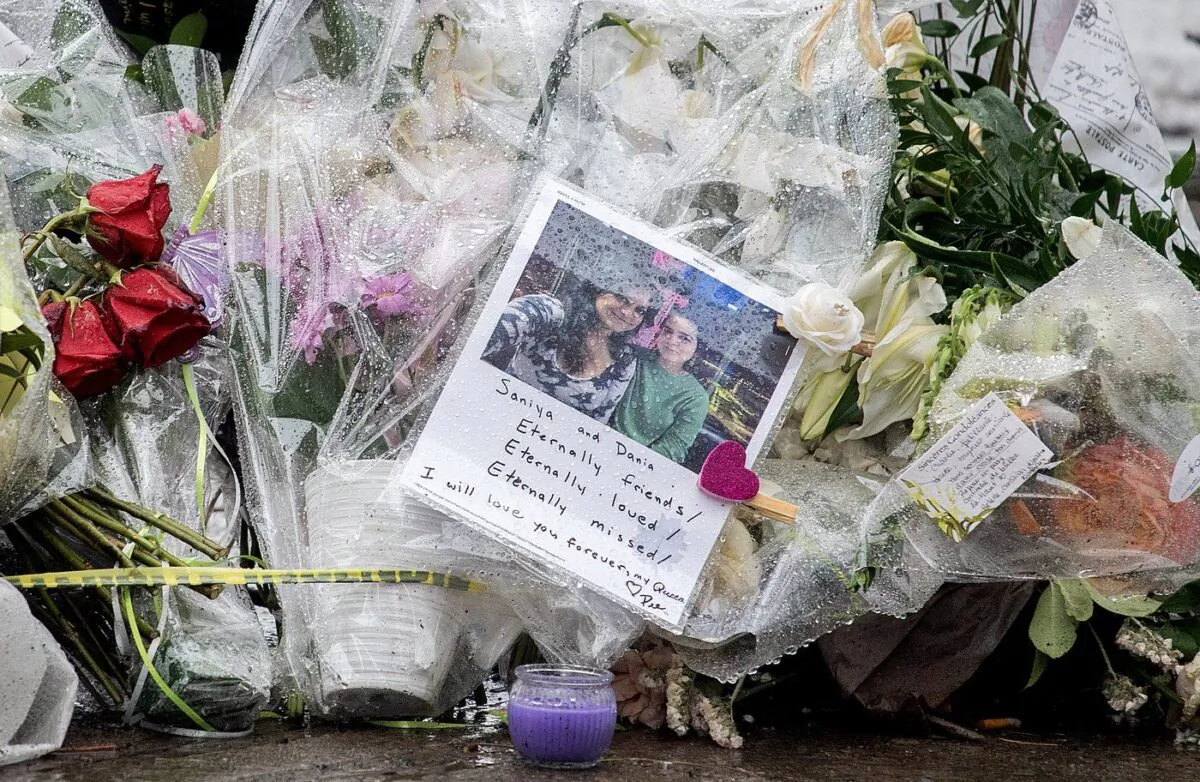 Flowers and messages are shown at a makeshift memorial near the site of the building, Thursday, March 23, 2023. (The Canadian Press/Graham Hughes)
