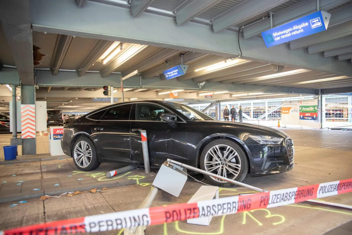 A damaged car is parked in parking lot 2 at Cologne/Bonn Airport on March 24, 2023. (Henning Kaiser/dpa via AP)