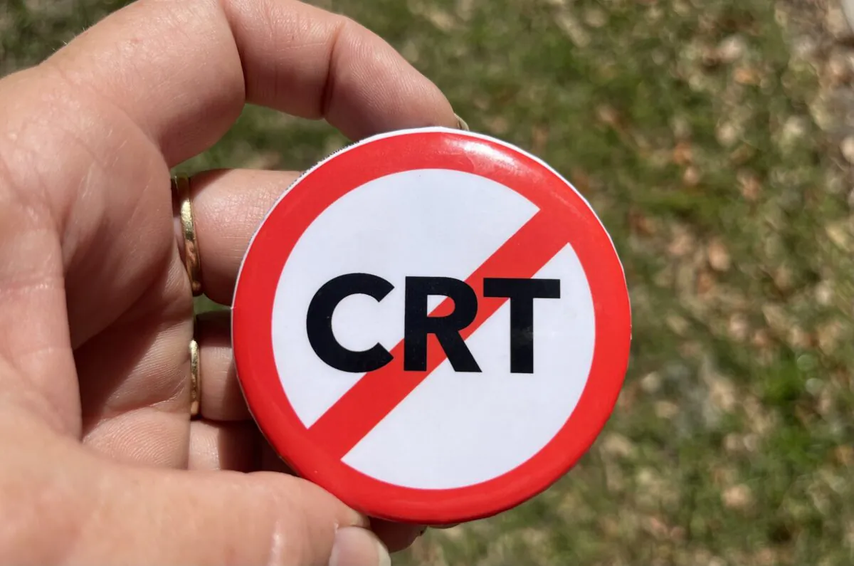 Parents concerned about critical race theory (CRT) took home buttons like this from a school board activist training put on by the The Leadership Institute in Sarasota, Fla., on Jan. 19, 2022. (Nanette Holt/The Epoch Times)