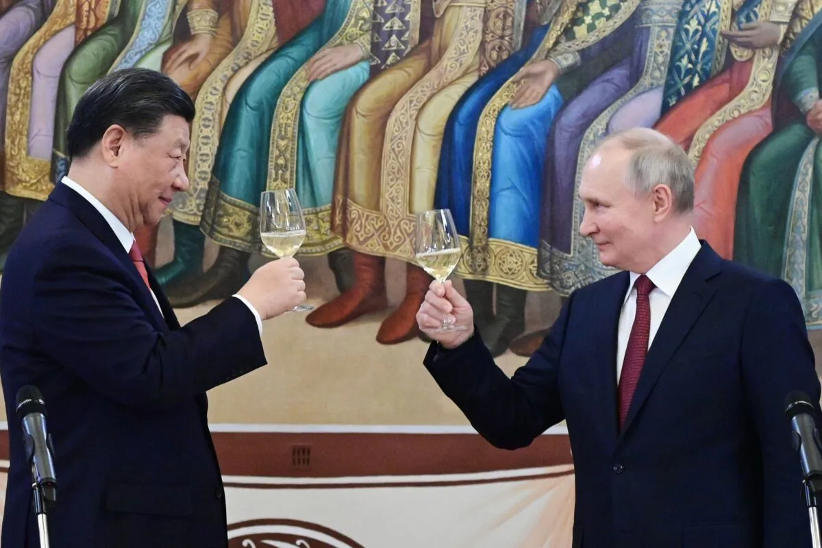 Chinese leader Xi Jinping and Russian President Vladimir Putin make a toast during their dinner at the Kremlin in Moscow on March 21, 2023. (Pavel Byrkin, Sputnik, Kremlin Pool Photo via AP)