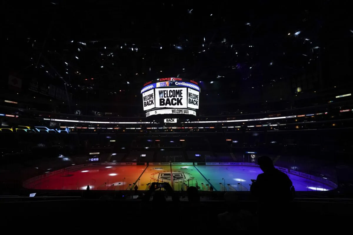 The ice is lit in rainbow light for Pride Night before an NHL hockey game between the Anaheim Ducks and the Los Angeles Kings in Los Angeles on April 26, 2021. (Ashley Landis/AP Photo)