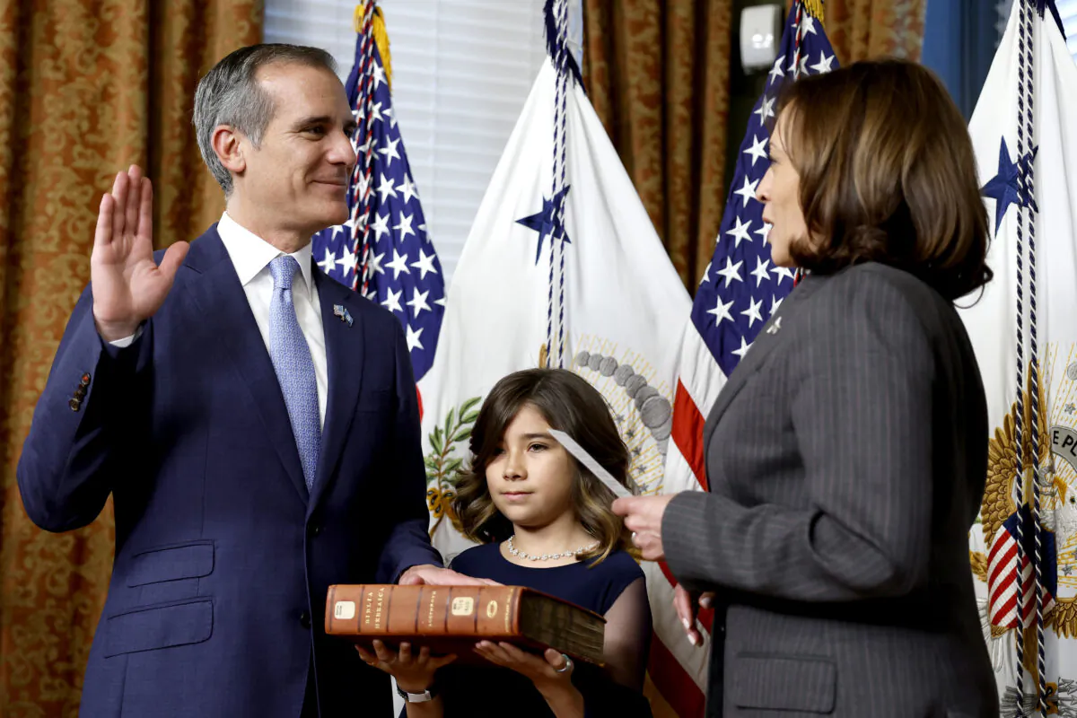 U.S. Vice President Kamala Harris ceremonially swears in Eric Garcetti as Ambassador to India alongside his daughter Maya Garcetti at the Eisenhower Executive Office Building  in Washington, DC., on March 24, 2023. (Anna Moneymaker/Getty Images)