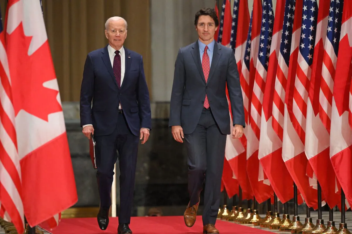 Prime Minister Justin Trudeau and U.S. President Joe Biden arrive for a joint press conference at the Sir John A. Macdonald Building in Ottawa on March 24, 2023. (Mandel Ngan/AFP via Getty Images)