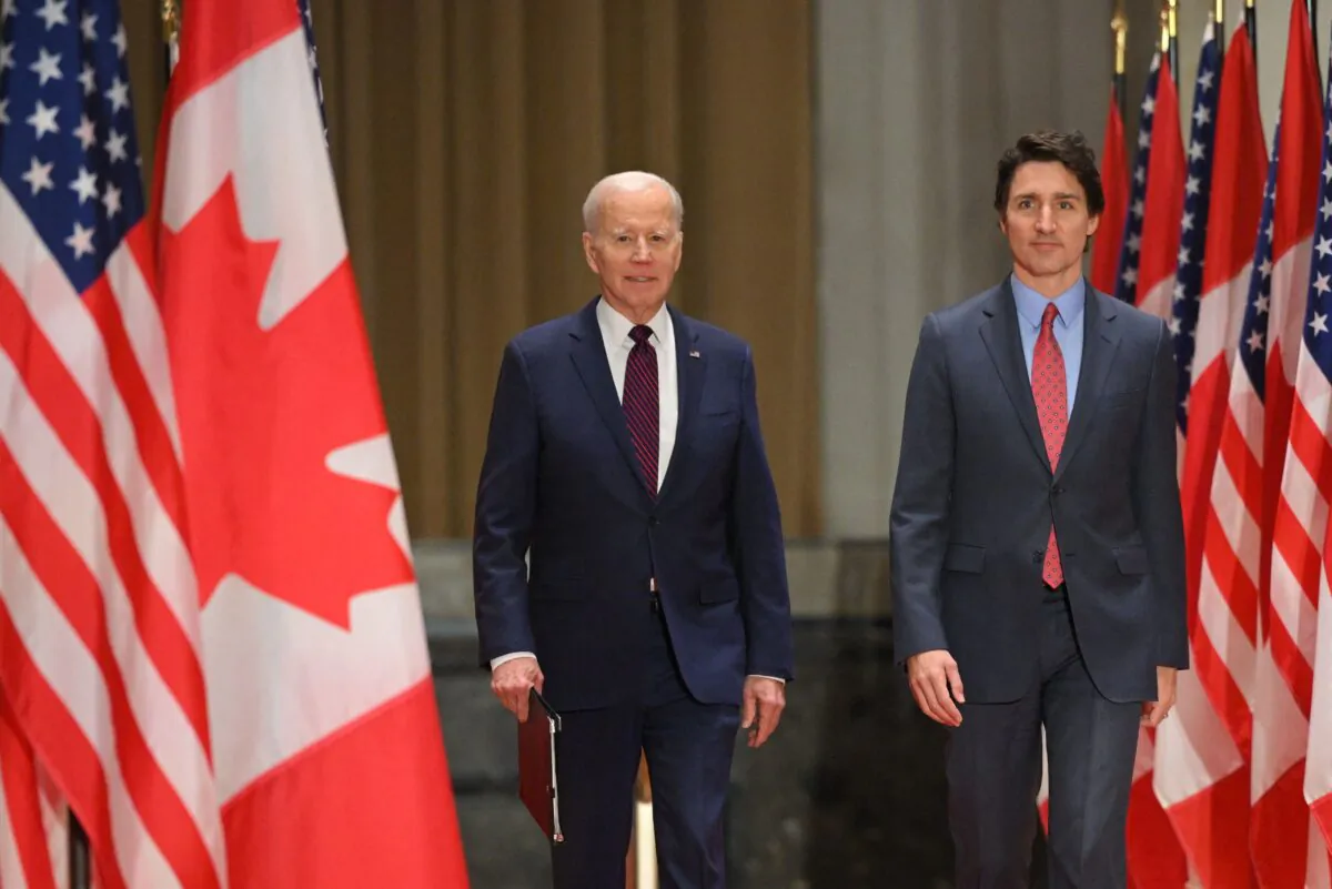 U.S. President Joe Biden and Prime Minister Justin Trudeau arrive for a joint press conference at the Sir John A. Macdonald Building in Ottawa on March 24, 2023. (Mandel Ngan/AFP via Getty Images)