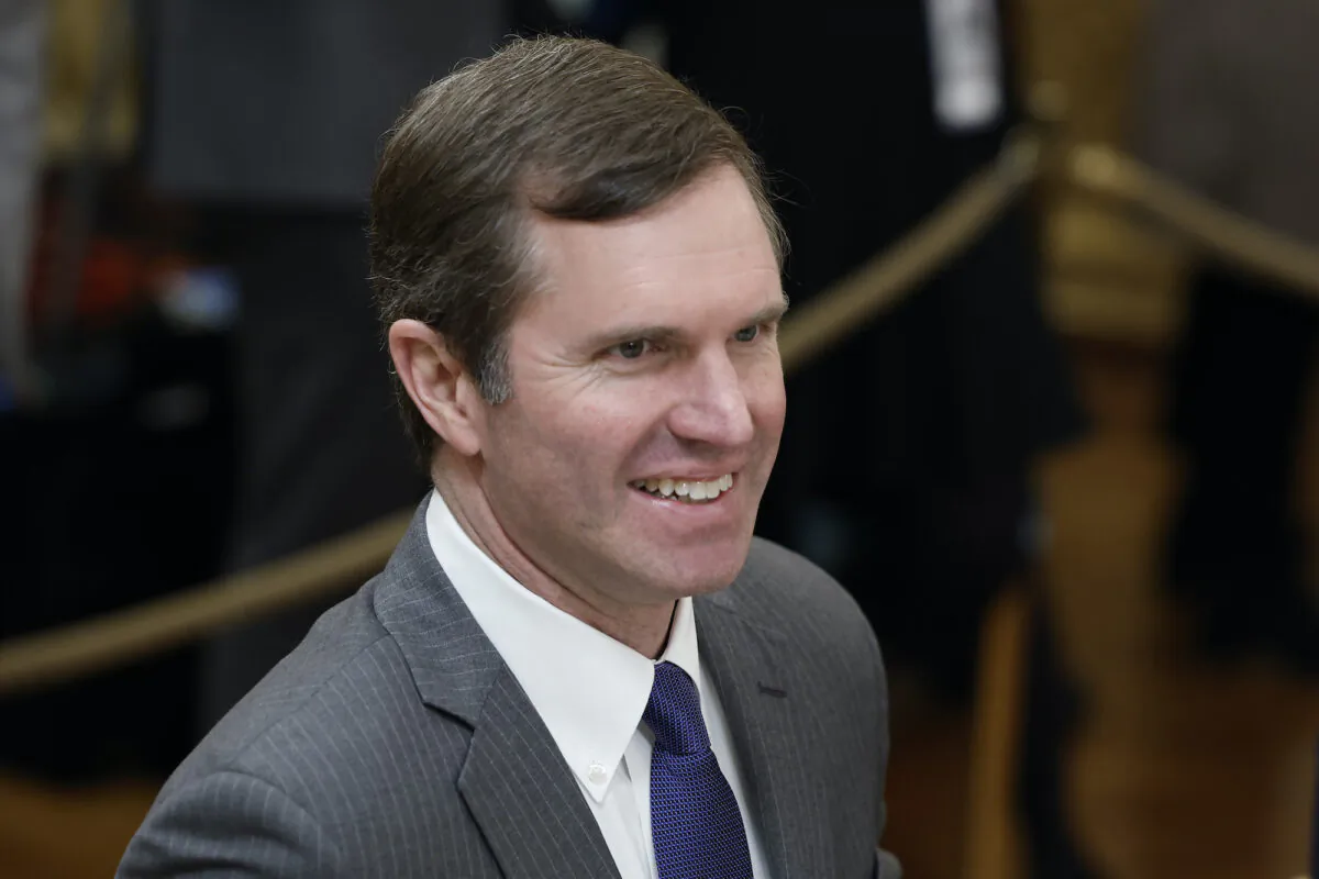Kentucky Gov. Andy Beshear walks to his seat before the start of a meeting between U.S. President Joe Biden and governors visiting from states around the country in the East Room of the White House on Feb. 10, 2023. (Anna Moneymaker/Getty Images)