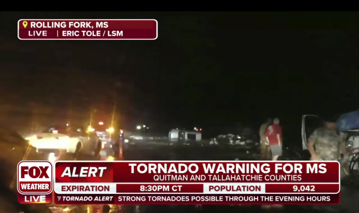 This screen grab from video broadcast by Fox Weather shows the immediate aftermath of severe weather in Rolling Fork, Miss., late on March 24, 2023. (Fox Weather via AP)