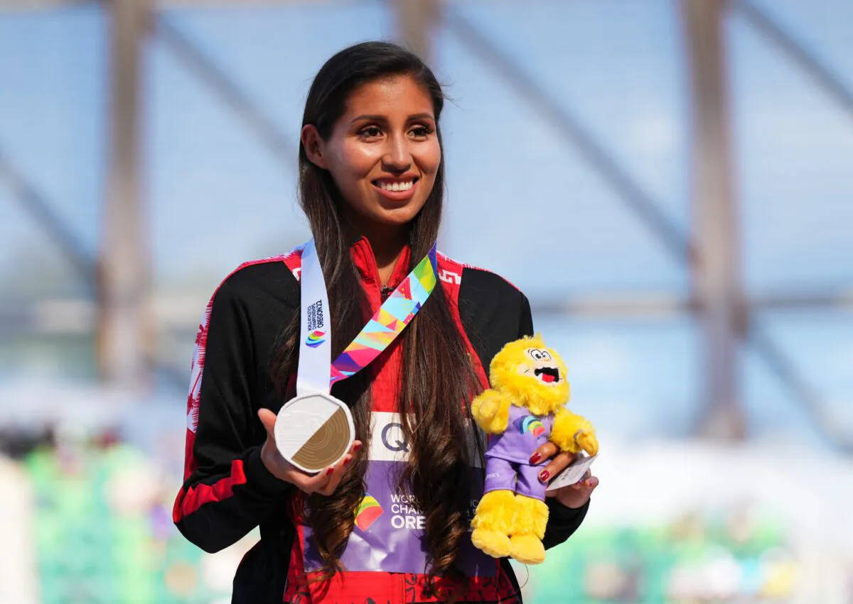 Gold medallist Peru's Kimberly Garcia Leon celebrates on the podium during the medal ceremony after winning the women's 35 kilometers race walk at World Athletics Championships in Eugene, Ore., on July 22, 2022. (Aleksandra Szmigiel/Reuters)