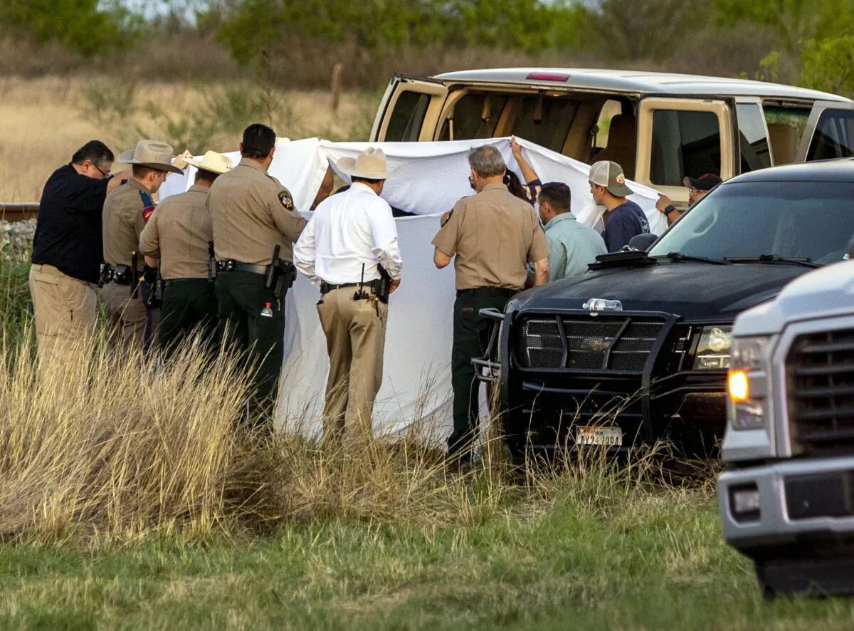 Officials investigate the scene where migrants were found trapped in a train car,  in Uvalde, Texas, on March 24, 2023. (William Luther/The San Antonio Express-News via AP)