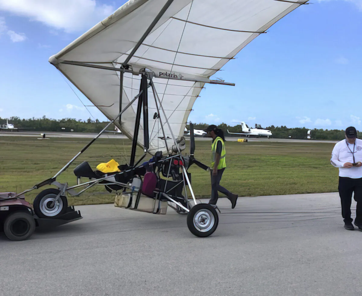 Key West International Airport personnel examine an ultralight aircraft that landed illegally at the airport carrying two Cuban men, in Key West, Fla., on March 25, 2023. (Monroe County Sheriff's Office /the Florida Keys News Bureau via AP)