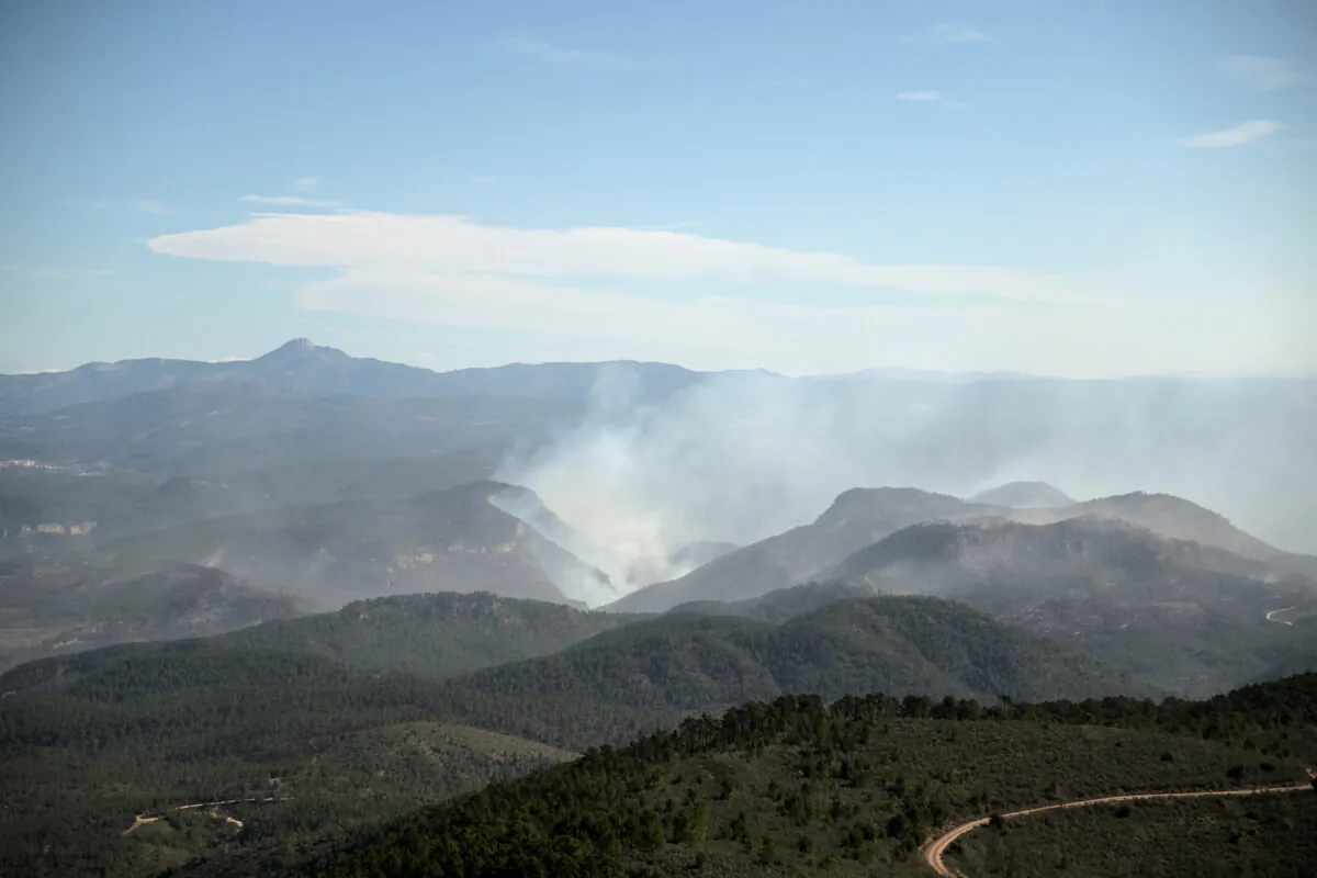 Wildfire smoke in Pina de Montalgrao, Castellon, following a wildfire raged in eastern Spain, on March 26, 2023. (Lorena Sopena/Reuters)