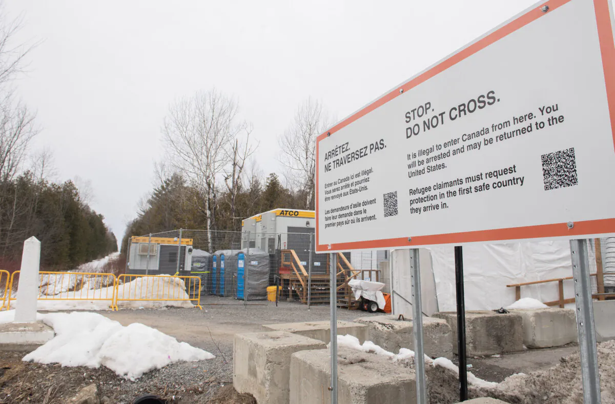 A sign advising people that entry into Canada via Roxham Road is illegal is seen at the Canada-U.S. border in Hemmingford, Que., on March 25, 2023. (The Canadian Press/Graham Hughes)