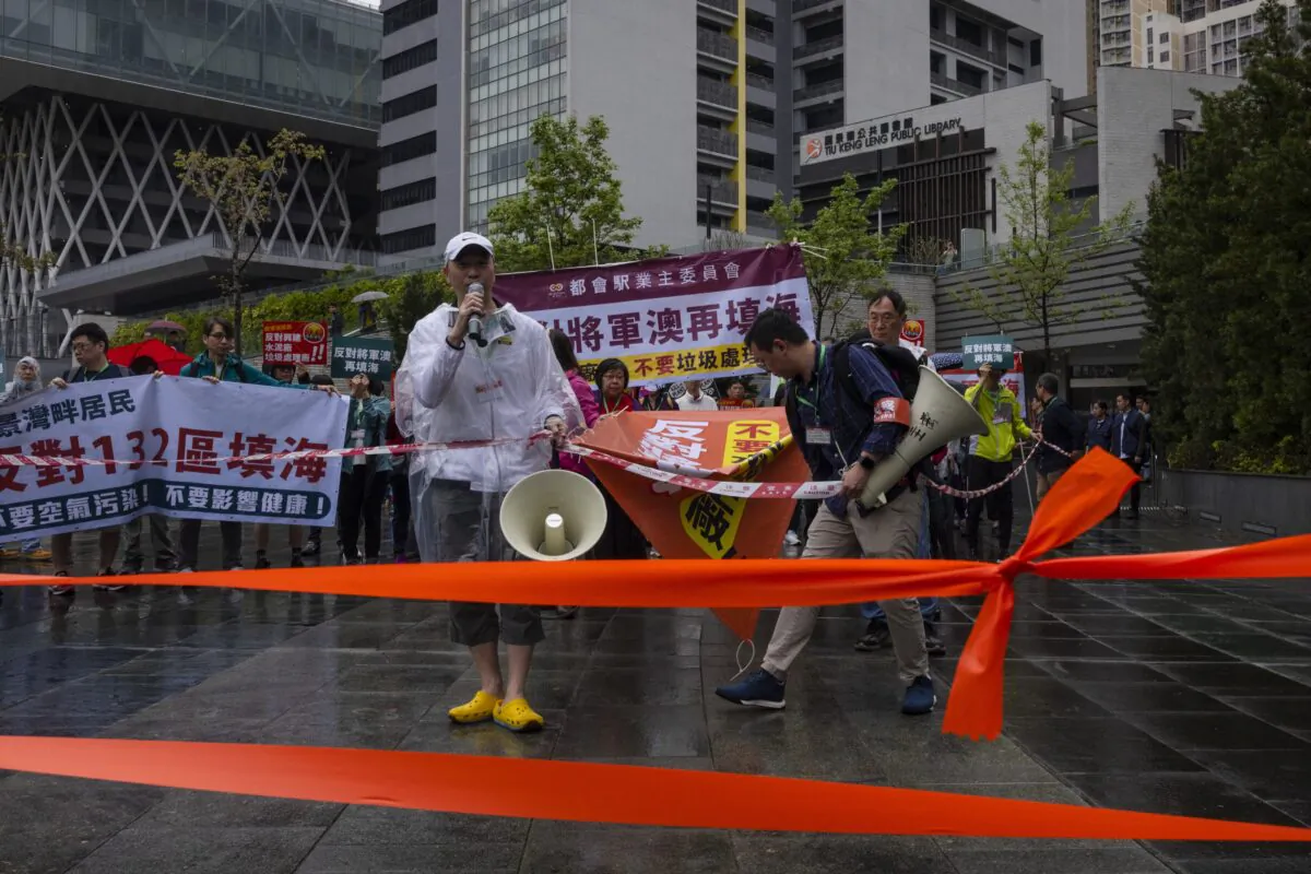 Protesters wearing number tags during a rally in Hong Kong on March 26, 2023. (Louise Delmotte/AP Photo)