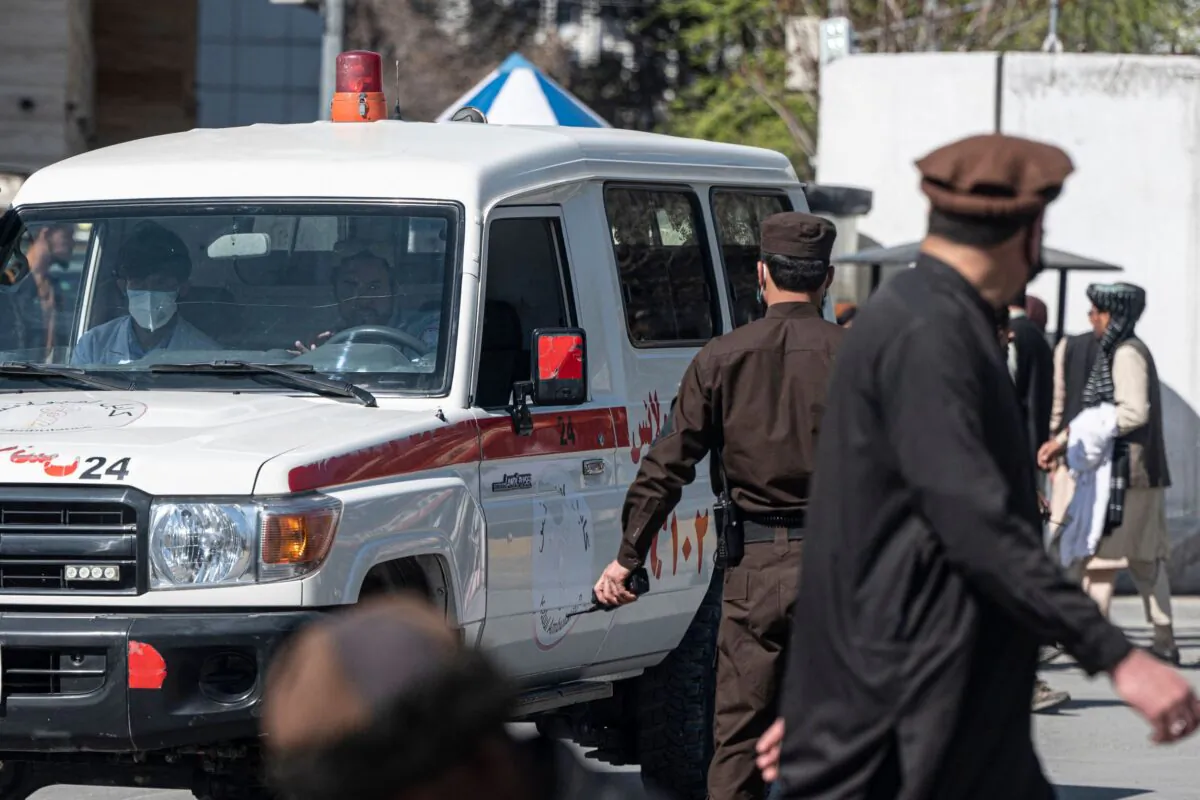 An ambulance carries victims from near the site of a suicide attack in Kabul on March 27, 2023. (Wakil Kohsar/AFP via Getty Images)
