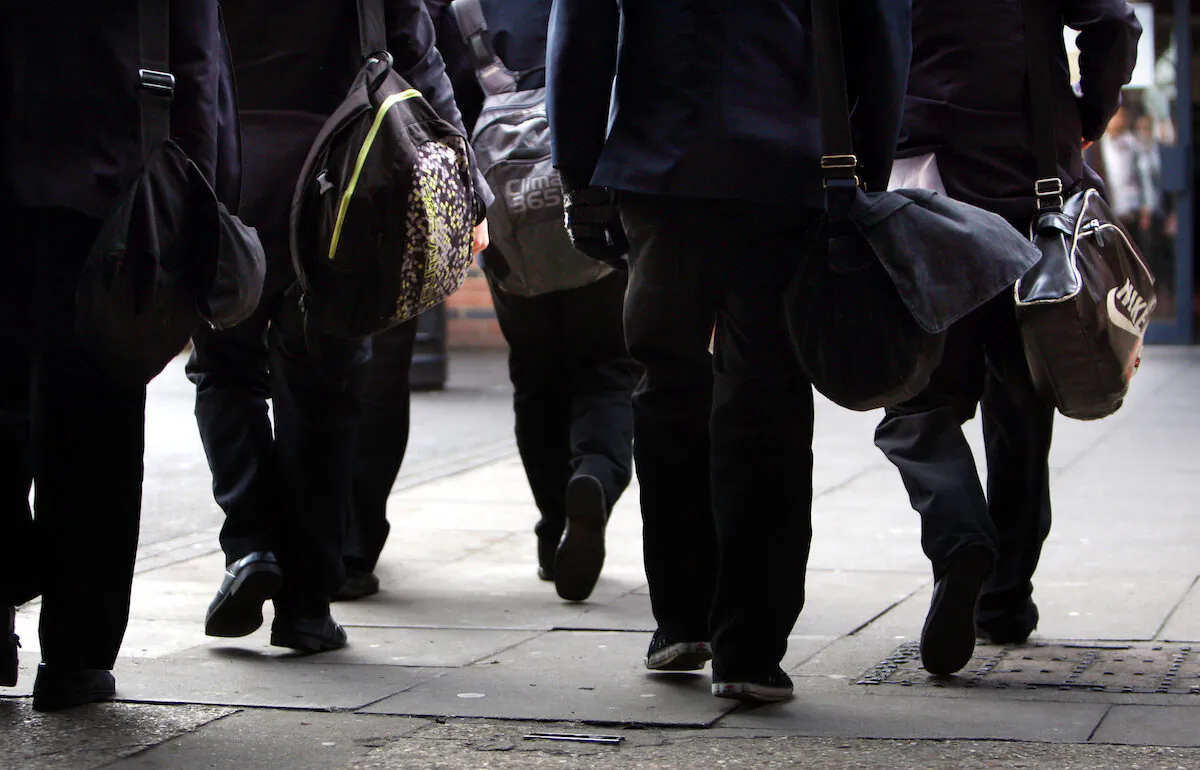 British school pupils walking to school on Nov. 26, 2012. (David Jones/PA Media)