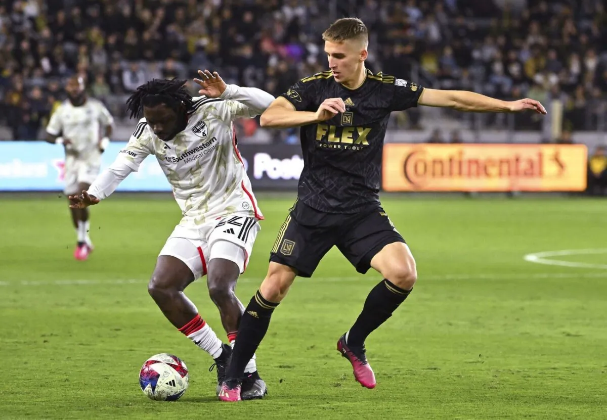 FC Dallas midfielder Ema Twumasi (22) and Los Angeles FC forward Stipe Biuk (7) battle for the ball in the first half at BMO Stadium in Los Angeles on Mar. 25, 2023. (Jayne Kamin-Oncea/USA TODAY Sports via Field Level Media)