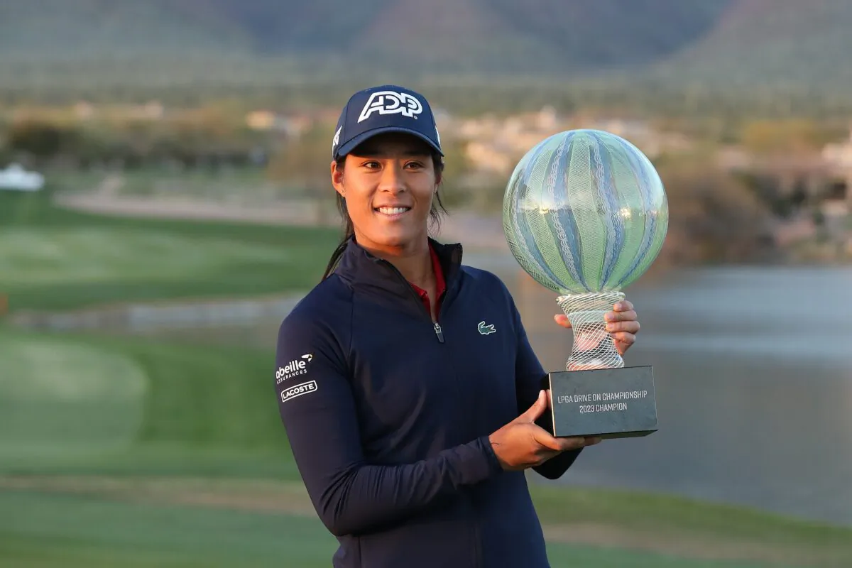 Celine Boutier of France poses with the winners trophy after a playoff win against Georgia Hall of England in the final round of the LPGA Drive On Championship at Superstition Mountain Golf and Country Club in Apache Junction, Ariz., on March 26, 2023. (Meg Oliphant/Getty Images)