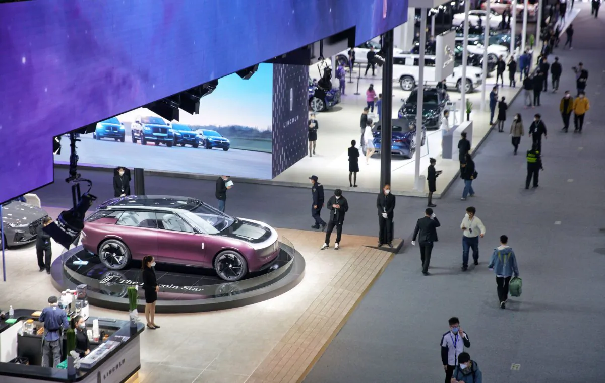 People visit the 20th Guangzhou International Automobile Exhibition on its opening day at Guangzhou, in China's southern Guangdong Province, on Dec. 30, 2022. (STR/AFP via Getty Images)