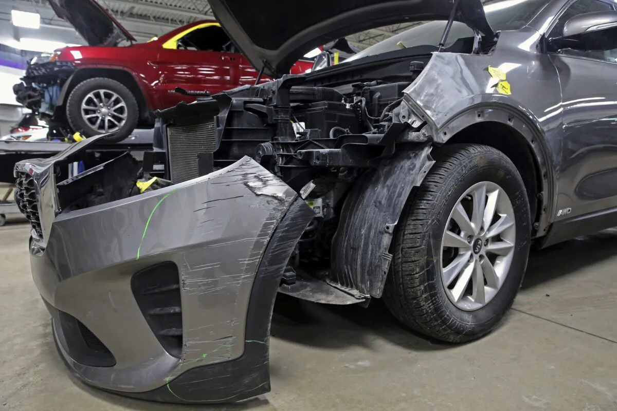 A Kia that was damaged after being stolen sits at an auto repair shop in Milwaukee on Jan. 27, 2021. (Angela Peterson/Milwaukee Journal-Sentinel via AP)