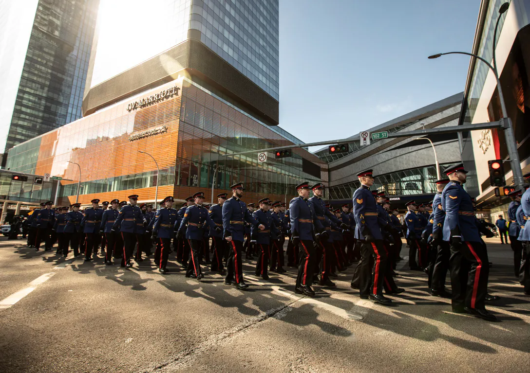 City police march during the procession for Edmonton Police Service constables Travis Jordan and Brett Ryan in Edmonton on March 27, 2023. The officers were killed in the line of duty on March 16, 2023. (Jason Franson/The Canadian Press)