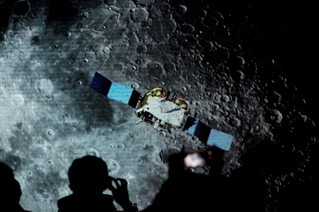 A screen shows footage during an event on China’s lunar exploration program at the National Astronomical Observatories of Chinese Academy of Sciences in Beijing on Jan. 18, 2021. (Tingshu Wang/Reuters)
