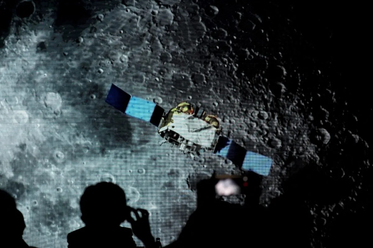 A screen shows footage during an event on China’s lunar exploration program at the National Astronomical Observatories of Chinese Academy of Sciences in Beijing on Jan. 18, 2021. (Tingshu Wang/Reuters)