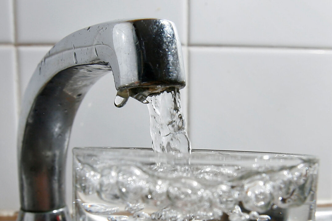 A glass of water is filled at a kitchen tap. (Cate Gillon/Getty Images)