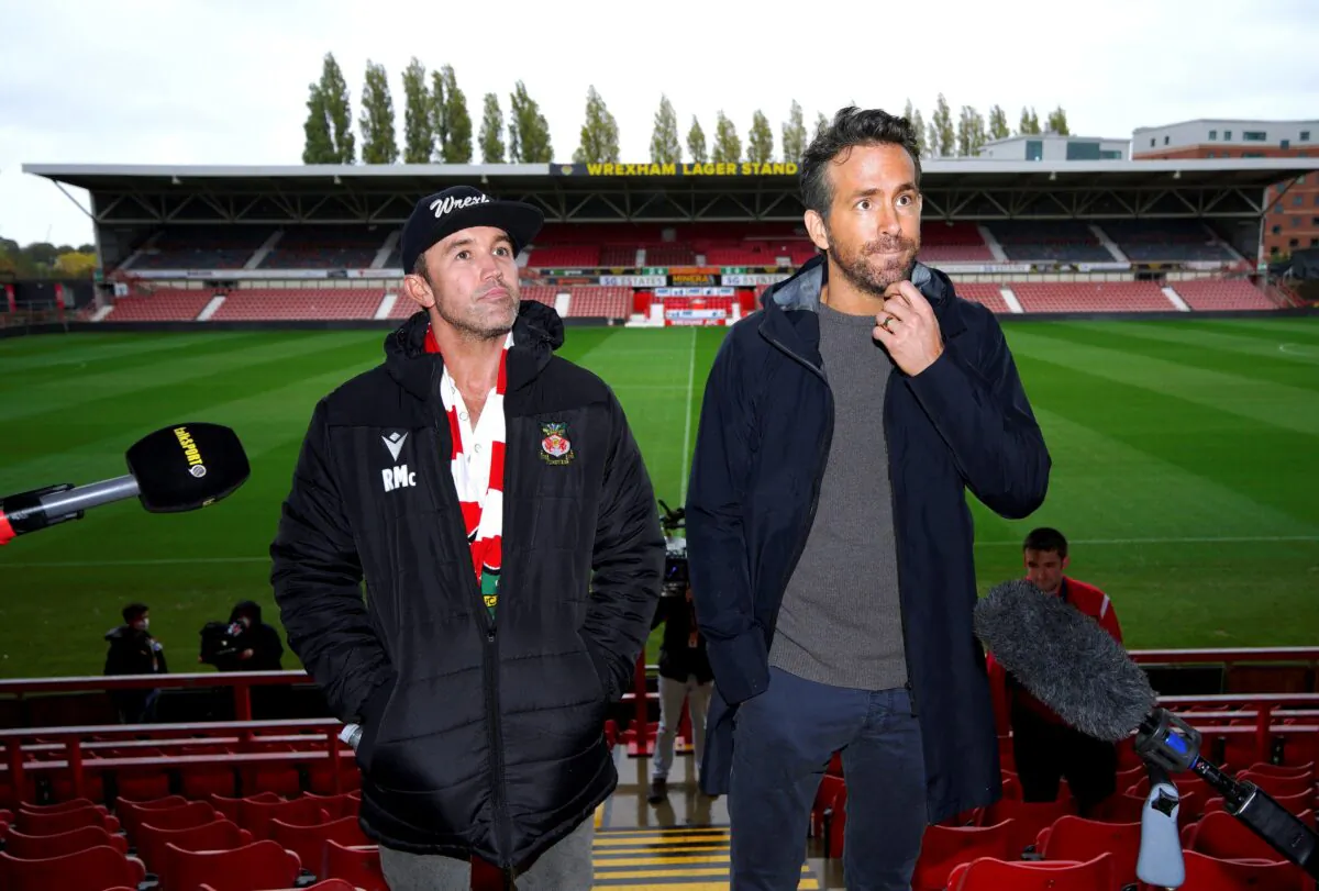 Wrexham co-chairmen Rob McElhenney (L), and Ryan Reynolds during a press conference at the Racecourse Ground, Wrexham, Wales, on Oct. 28, 2021. (Peter Byrne/PA via AP)