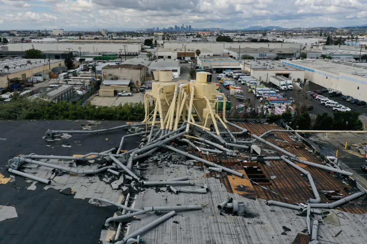 Damage to the roof of an industrial building from a tornado during a winter storm in Montebello, Los Angeles County, California, on March 23, 2023. (Patrick T. Fallon/AFP via Getty Images)