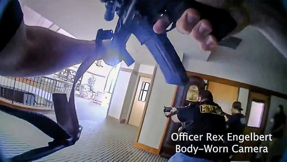 This image provided by Metropolitan Nashville Police Department shows bodycam footage of police responding to an active shooting at The Covenant School in Nashville, Tenn., on March 27, 2023. (Metropolitan Nashville Police Department via AP)