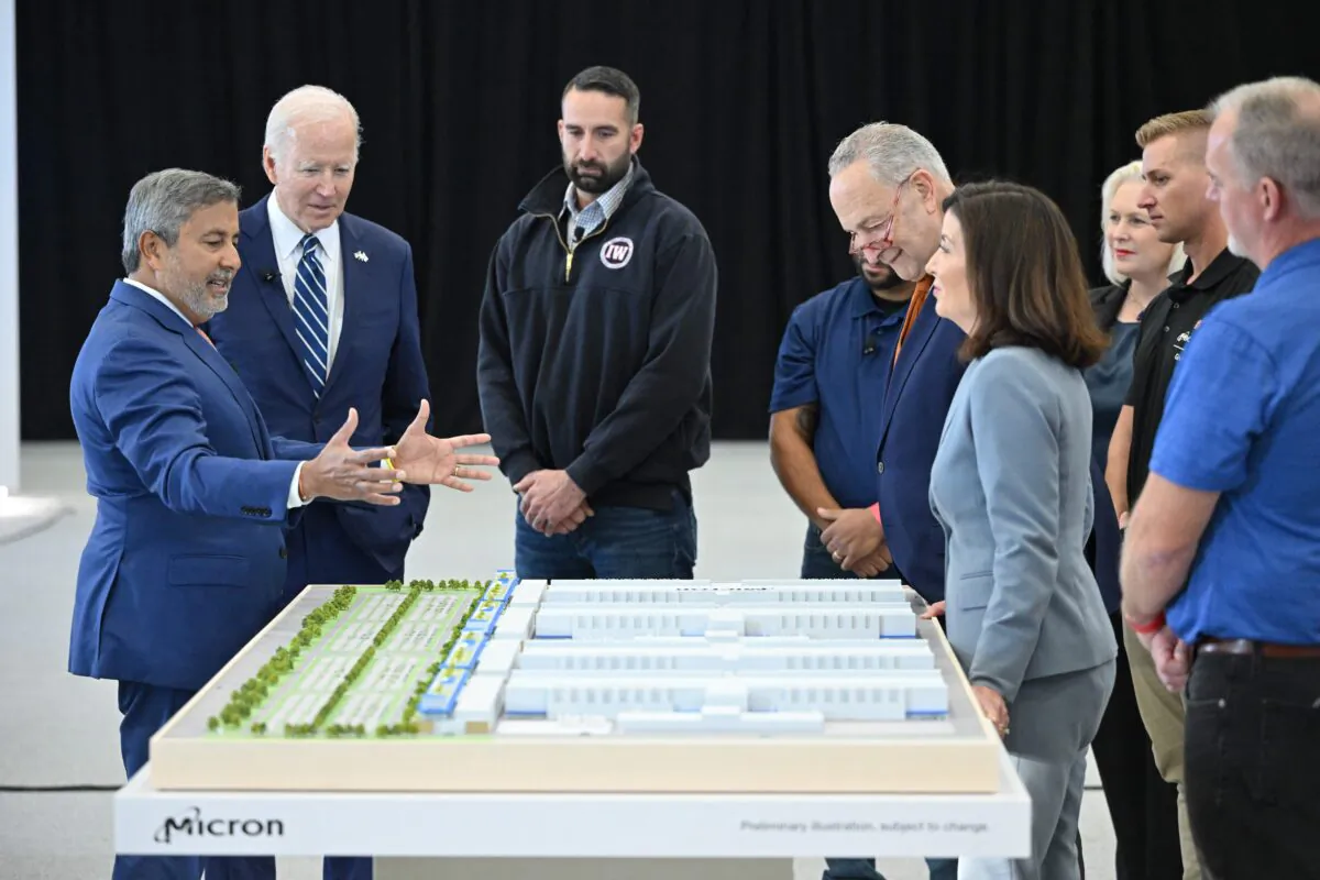 President Joe Biden (2nd L) looks at a 3D rendering of a future Micron factory presented by CEO of Micron Technology Sanjay Mehrotra (L) during a tour of the Micron Pavilion at the SRC Arena and Events Center of Onondaga Community College in Syracuse, N.Y., on Oct. 27, 2022.
MANDEL NGAN/AFP via Getty Images