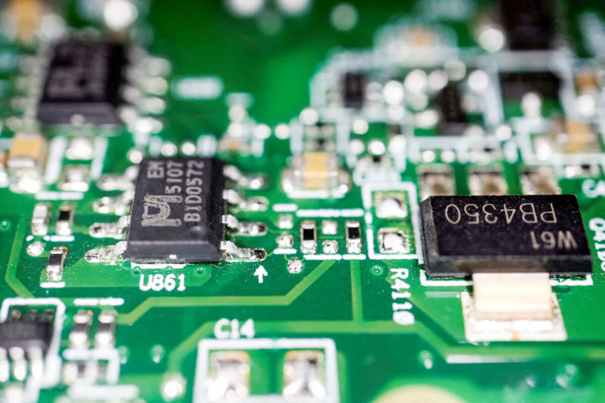 Semiconductor chips on a printed circuit board on Feb. 17, 2023. (Florence Lo/Illustration/Reuters)