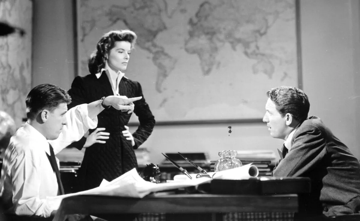 A behind-the-scenes photo from the film "Woman of the Year" (1942) with (L-R) director George Stevens, Katharine Hepburn, and Spencer Tracy. (MovieStillsDB)