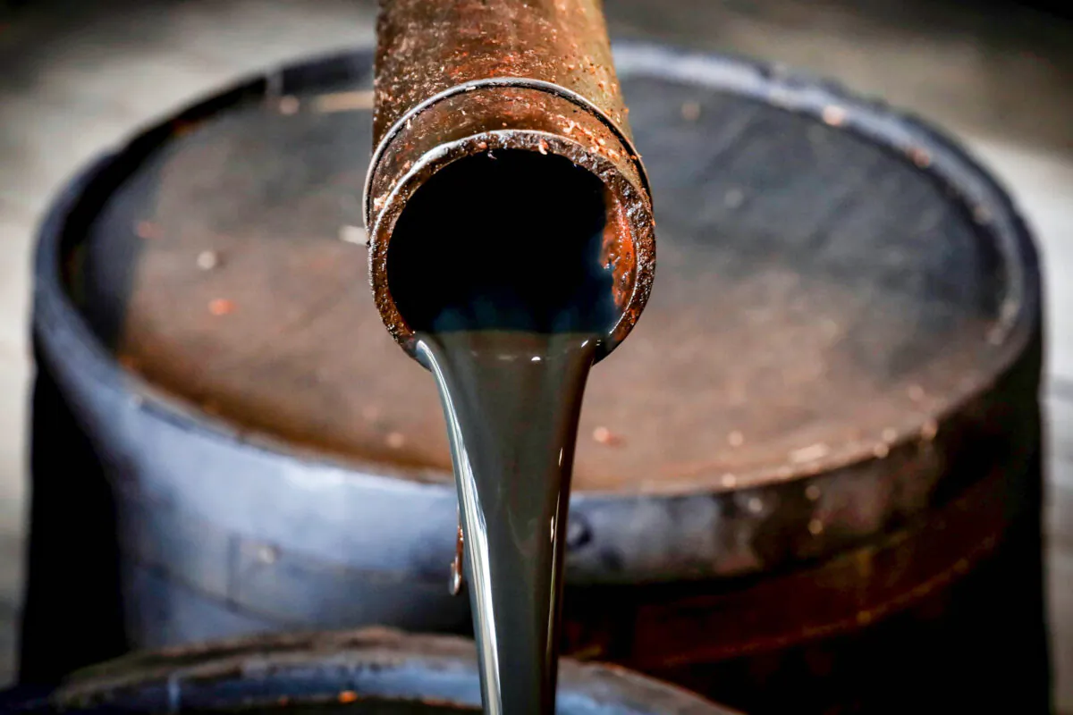 Oil pours out of a spout from the original 1859 well that launched the modern petroleum industry at the Drake Well Museum and Park in Titusville, Pa., on Oct. 5, 2017. (Brendan McDermid/Reuters)
