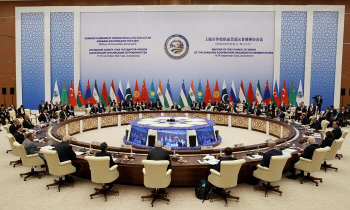 Participants of the Shanghai Cooperation Organization summit attend an extended-format meeting of heads of SCO member states in Samarkand, Uzbekistan, on Sept. 16, 2022. (Sputnik/Sergey Bobylev/Pool via Reuters)