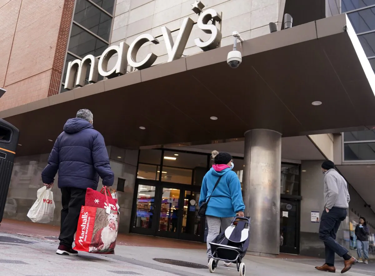 Shoppers walk to the Macy's store in the Downtown Crossing district in Boston on Nov. 17, 2021. (Charles Krupa/AP Photo)