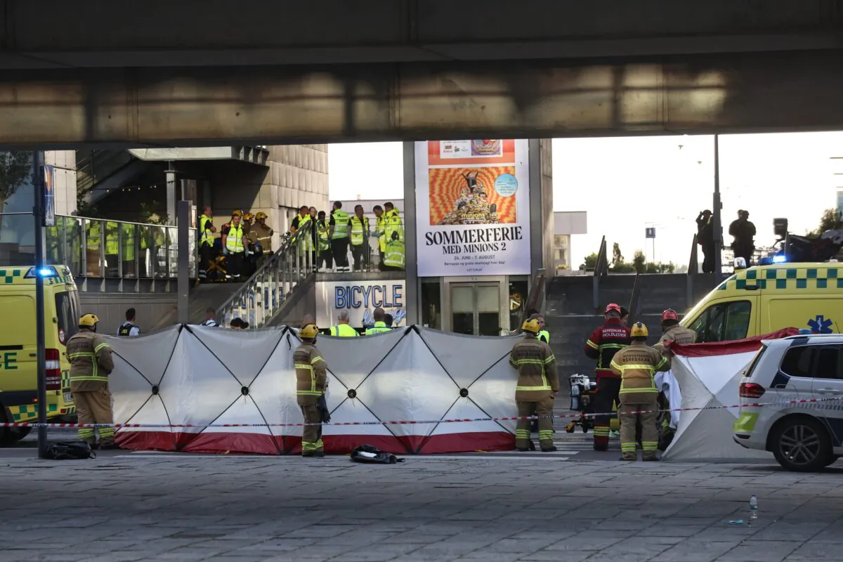 Emergency service members gather at the Field's shopping center after a shooting in Copenhagen, Denmark, on July 3, 2022. (Olafur Steinar Gestsson/Ritzau Scanpix via AP)