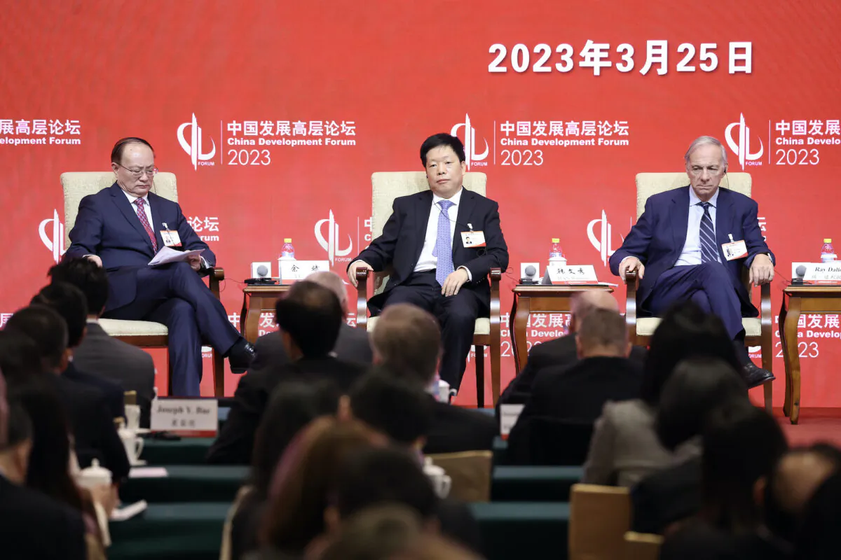 (L-R) Yu Bin, vice president of Development Research Center of the State Council, Han Wenxiu, executive deputy director of the General Office of the Central Financial, Ray Dalio, founder of Bridgewater Associates LP, attend the China Development Forum (CDF) 2023 at Diaoyutai State Guesthouse in Beijing on March 25, 2023. (Lintao Zhang/Getty Images)