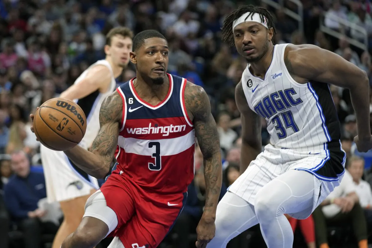 Washington Wizards' Bradley Beal (3) makes a move to get around Orlando Magic's Wendell Carter Jr. (34) during the second half of an NBA basketball game in Orlando, Fla., on March 21, 2023. (John Raoux/AP Photo)