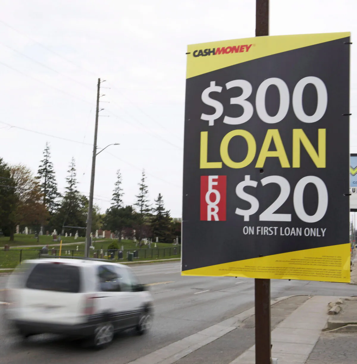 A road side sign for a pay day loan store is shown in Oshawa, Ont., on May 13, 2017. (Doug Ives/The Canadian Press)
