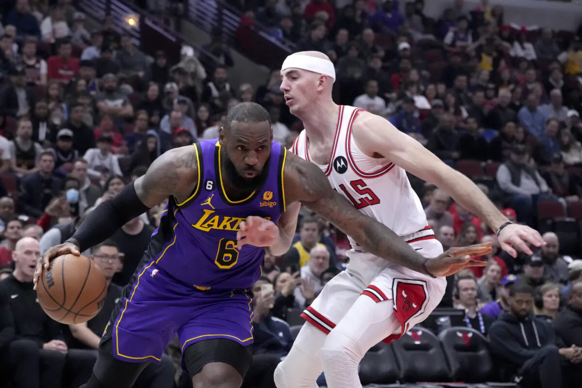 Los Angeles Lakers' LeBron James drives to the basket as Chicago Bulls' Alex Caruso defends during the first half of an NBA basketball game in Chicago on March 29, 2023. (Charles Rex Arbogast/AP Photo)