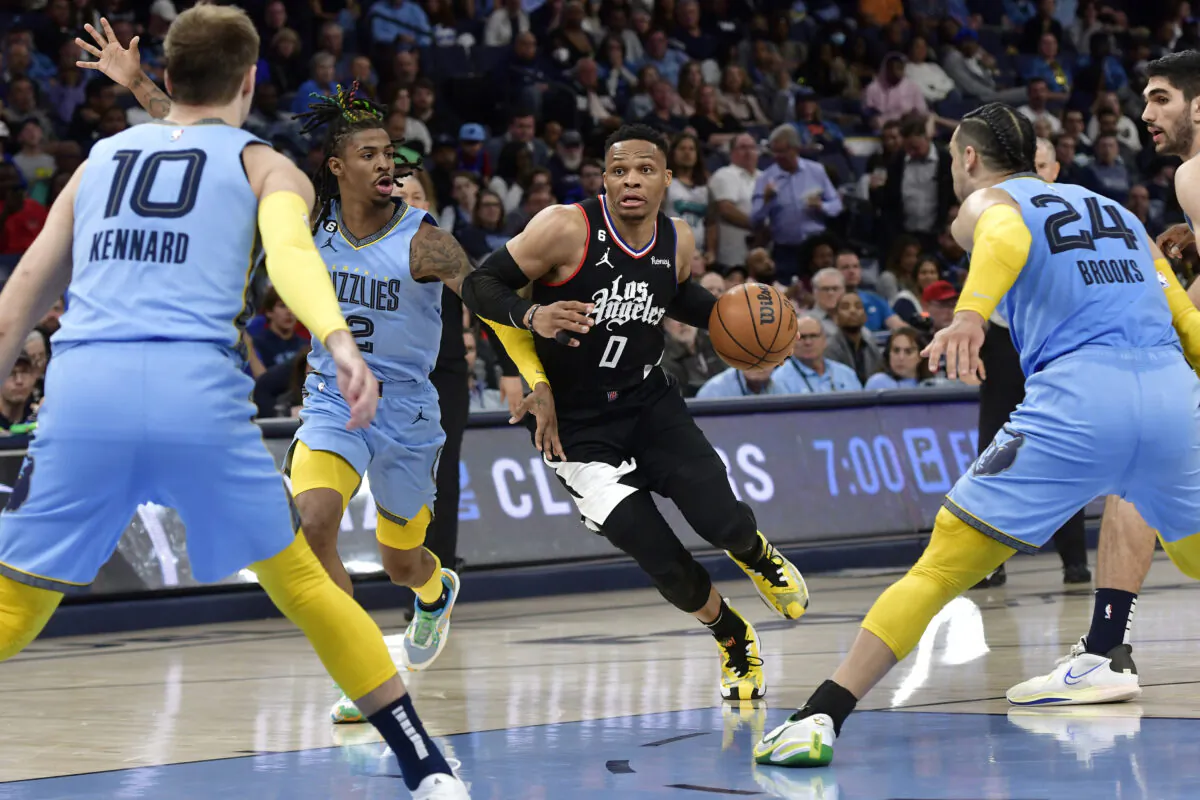 Los Angeles Clippers guard Russell Westbrook (0) drives against Memphis Grizzlies guard Ja Morant in the second half of an NBA basketball game in Memphis on March 29, 2023. (Brandon Dill/AP Photo)