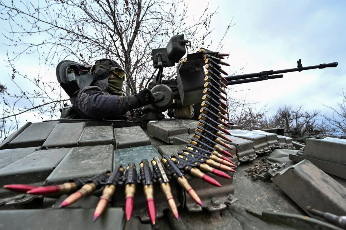 A Ukrainian serviceman checks a tank machine gun after loading ammunition during military training near a frontline, amid Russia's attacks on Ukraine, in the Zaporizhzhia Region, Ukraine, on March 29, 2023. (Stringer/Reuters)
