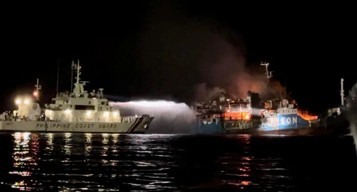 Philippine Coast Guard respond to the fire incident onboard M/V LADY MARY JOY 3 at the waters off Baluk-Baluk Island, Hadji Muhtamad, Basilan, Philippines, on March 29, 2023. (Philippine Coast Guard/Handout via Reuters)