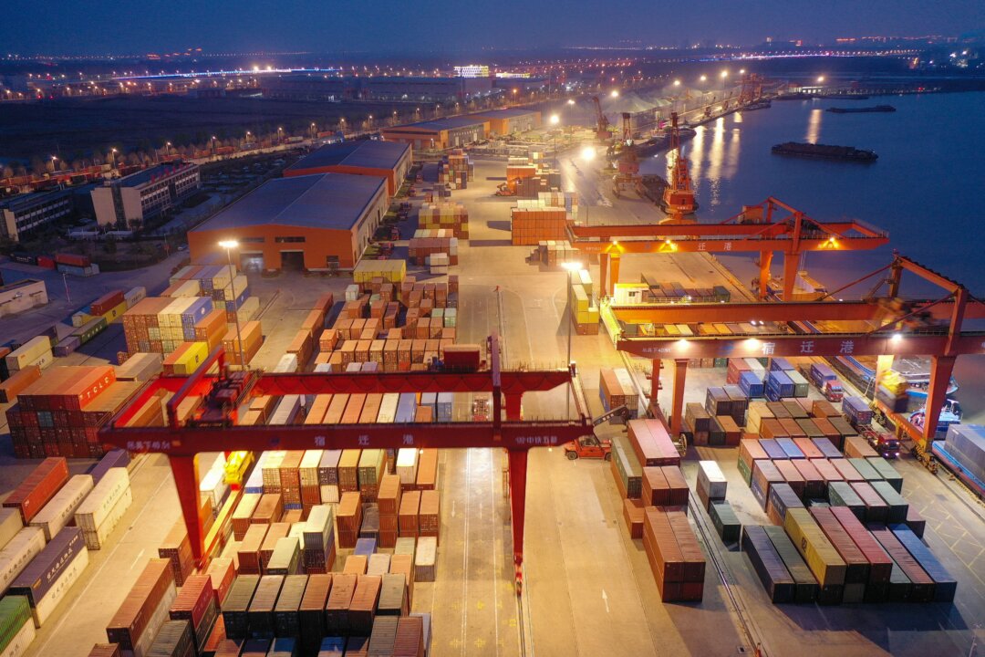 Shipping containers stacked at Suqian port, Jiangsu Province, China, on March 26, 2023. (STR/AFP via Getty Images)