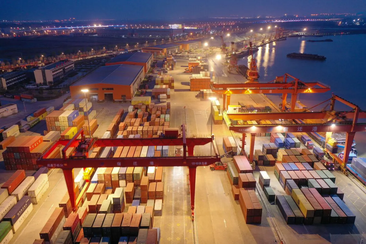 Shipping containers stacked at Suqian port in China's eastern Jiangsu Province on March 26, 2023. (STR/AFP via Getty Images)