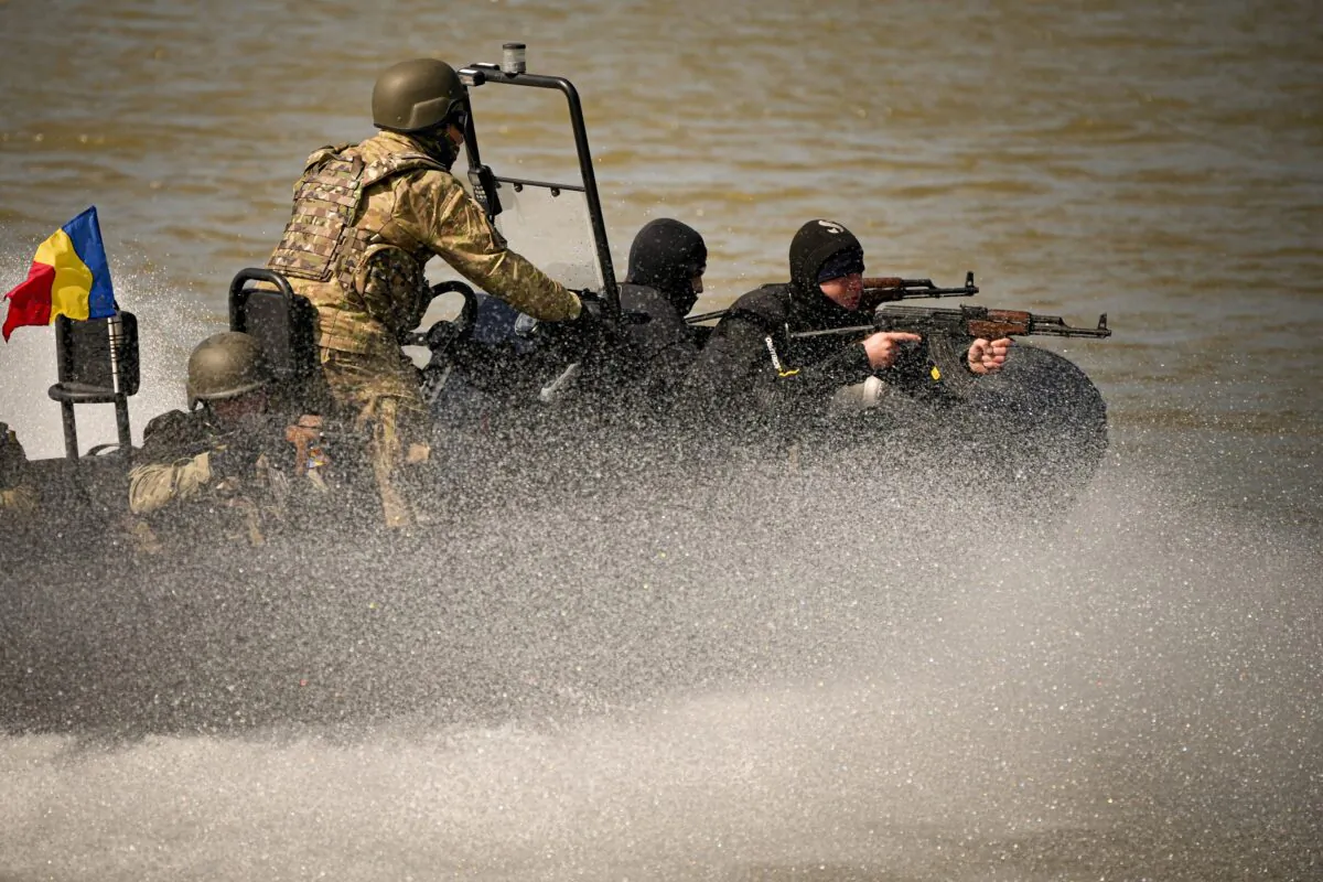 Naval commandos sail on the river Danube during a Romanian Navy led exercise outside Mahmudia, Romania, on March 30, 2023. (Andreea Alexandru/AP Photo)