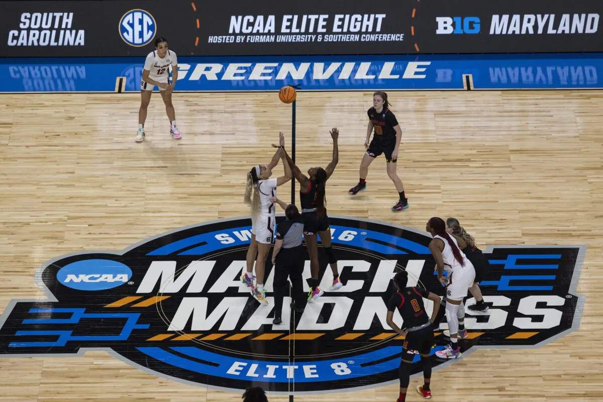 South Carolina's Victaria Saxton (L) and Maryland's Diamond Miller (L) jump the ball to start their Elite 8 game in the first half of an Elite 8 college basketball game of the NCAA Tournament in Greenville, S.C., on March 27, 2023. (Mic Smith/AP Photo)