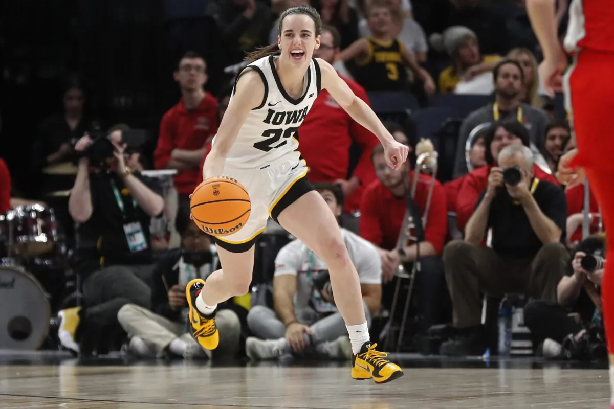 Iowa guard Caitlin Clark smiles after catching her 10th rebound to give her a triple-double against Ohio State in the second half of an NCAA college basketball championship game at the Big Ten women's tournament in Minneapolis on March 5, 2023. (Bruce Kluckhohn/AP Photo)